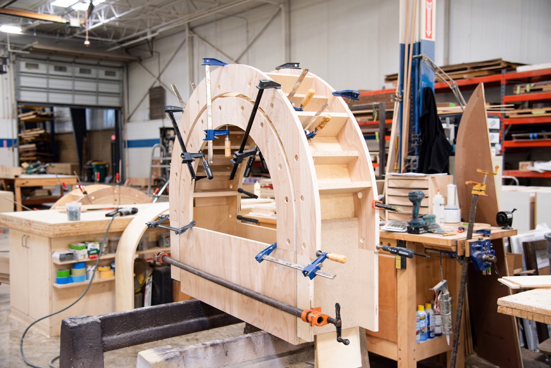 Arched casework clamped up at the bench