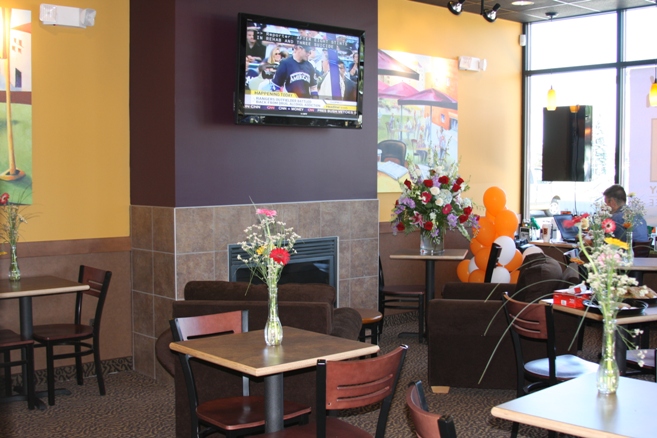 Biggby Coffee interior with custom fireplace surround