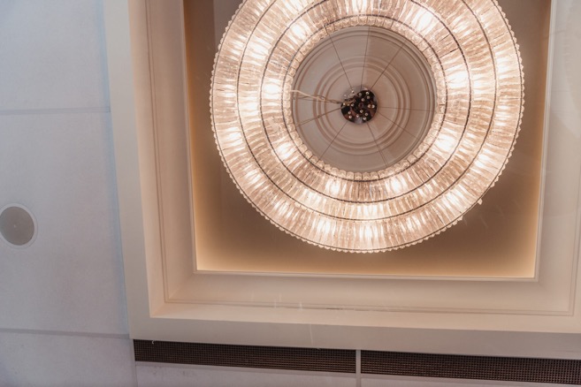 Italian American Club ballroom with chandelier and millwork detail