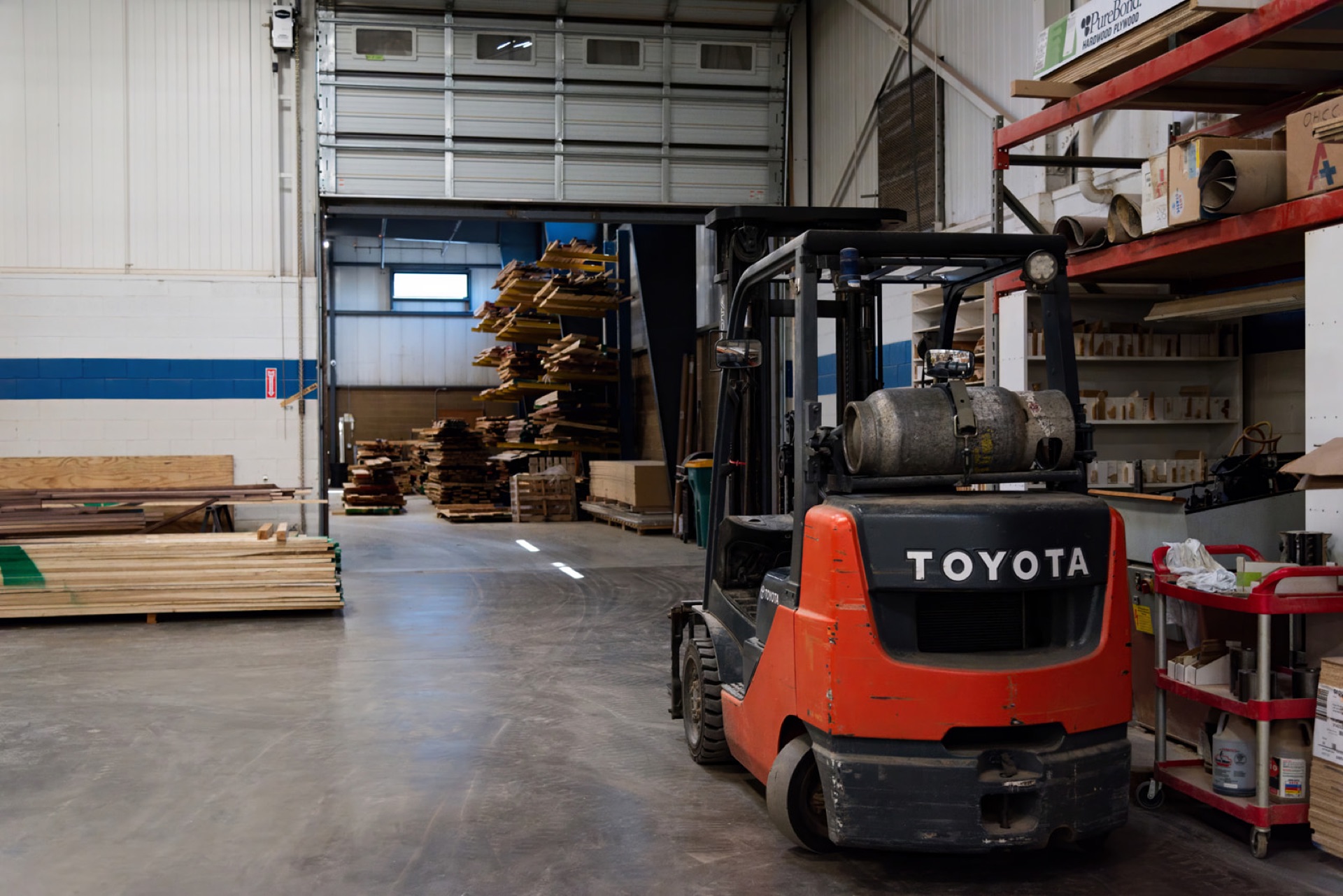 Forklift loading finished casework for sequenced delivery to the job site